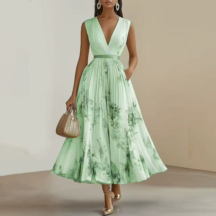 Back view of Elegant Pleated Maxi Dress showing full-length silhouette and floral pattern
