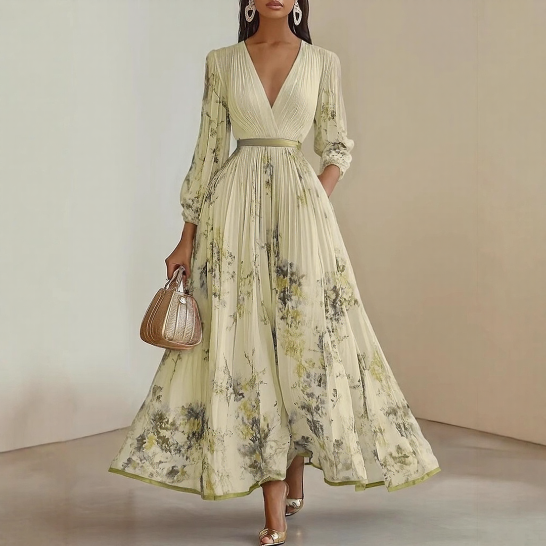Model wearing Elegant Pleated Maxi Dress in white with delicate floral print throughout
