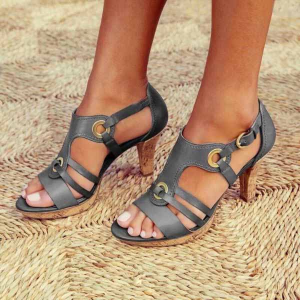Elegant & Statement Heeled Sandals with chunky block heel and metal ring detailing on structured straps