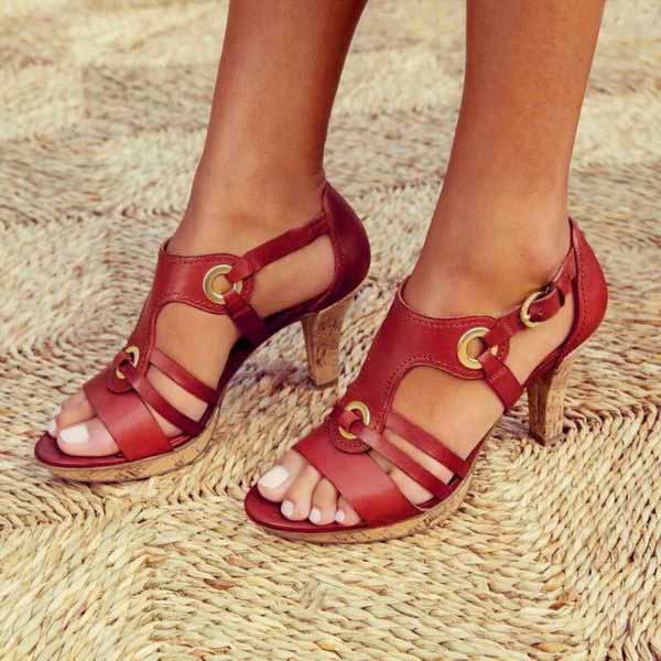 Side angle of statement heeled sandals showing stable chunky heel and refined strap design