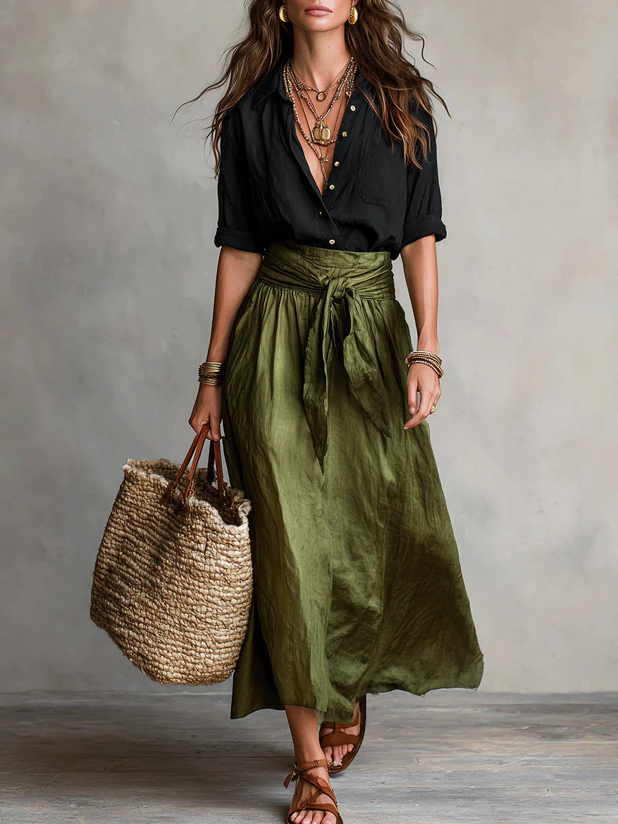 Woman wearing Women Casual Skirt Two-Piece Set with black shirt and olive green maxi skirt with tie-waist detail