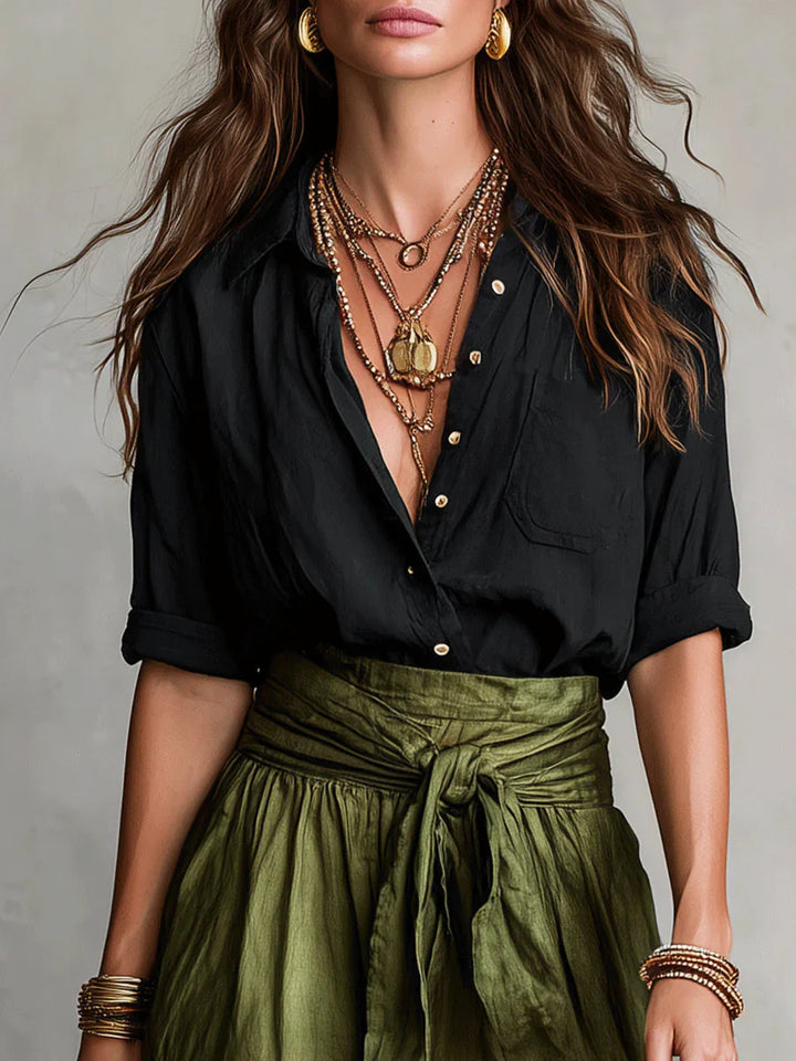 Detail shot of Women Casual Skirt Two-Piece Set highlighting chest pocket and rolled cuffs on shirt