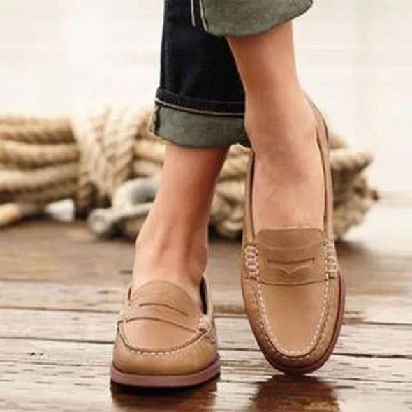 Side view of Women's Orthopedic Classic Penny Loafers showing slip-on construction and structured silhouette