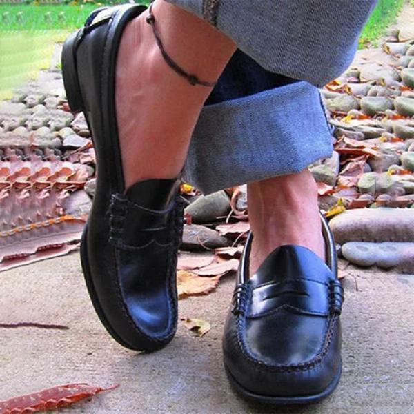 Close-up of Women's Orthopedic Classic Penny Loafers featuring traditional penny strap and smooth finish