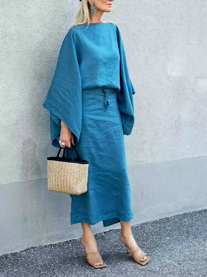 Rear view of Women Elegant Kaftan Dress with flowing drape and wide sleeves
