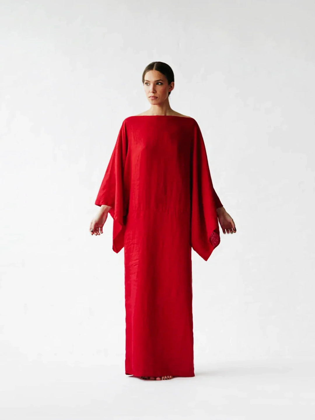 Women Elegant Kaftan Dress showing relaxed fit and midi-length hemline
