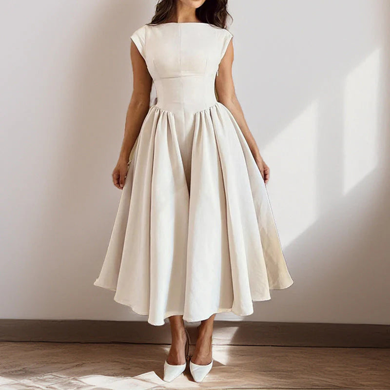 Detail of round neckline and cap sleeves on fit and flare midi dress