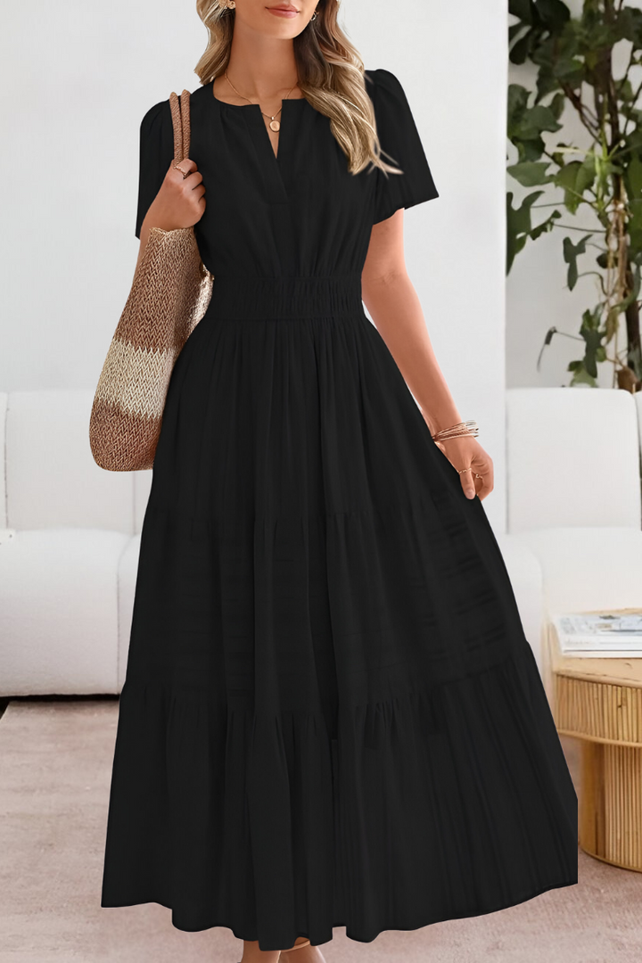 Close-up view of the Boho Breeze Midi Dress showing notch neckline and short sleeves