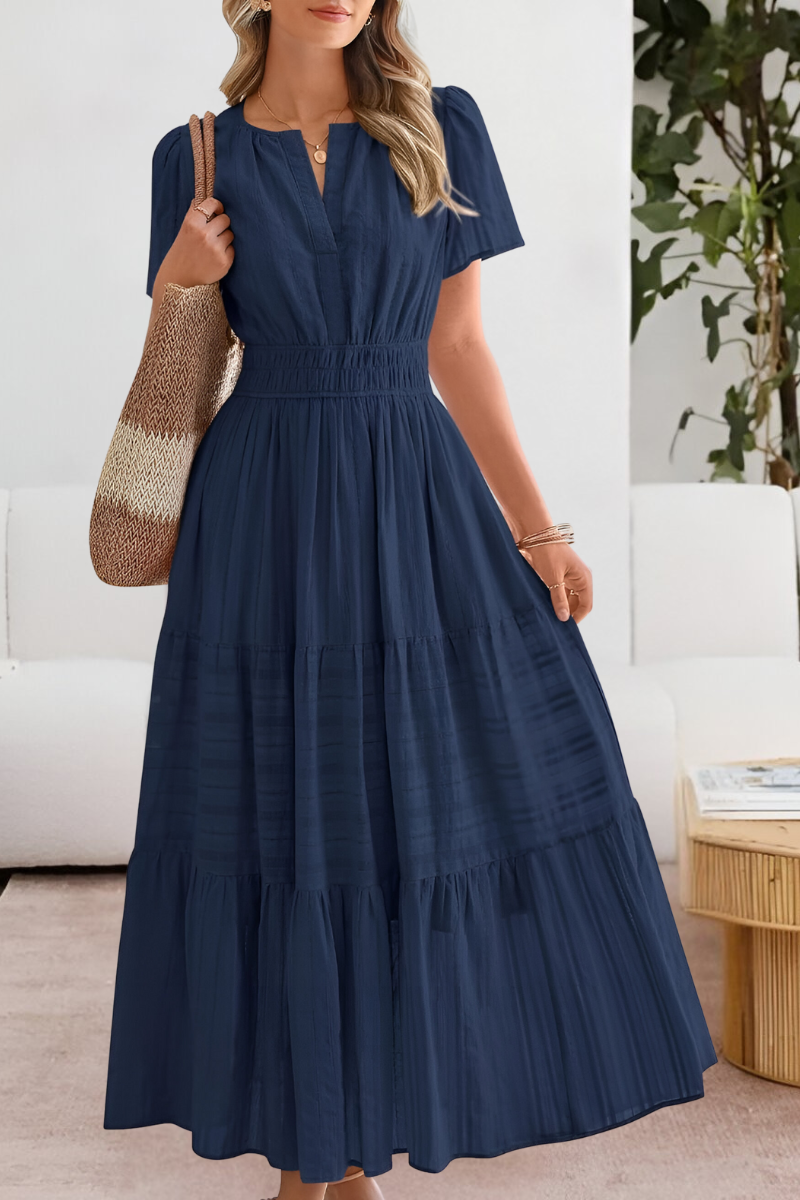 Side view of the tiered midi dress highlighting the relaxed A-line silhouette