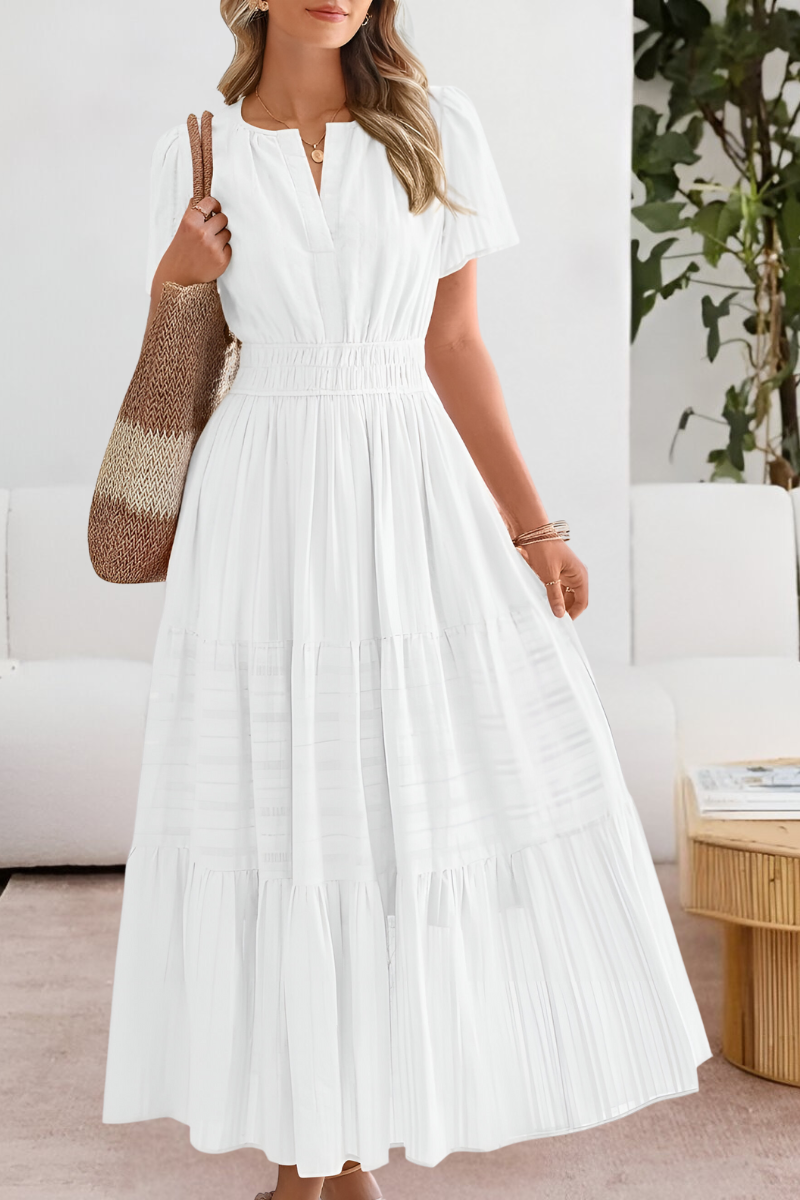 Full-length view of the Boho Breeze Midi Dress paired with woven accessories