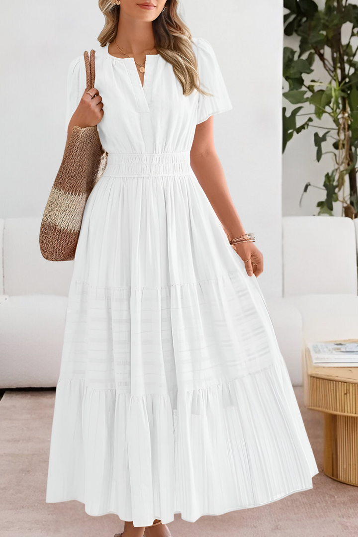 Full-length view of the Boho Breeze Midi Dress paired with woven accessories