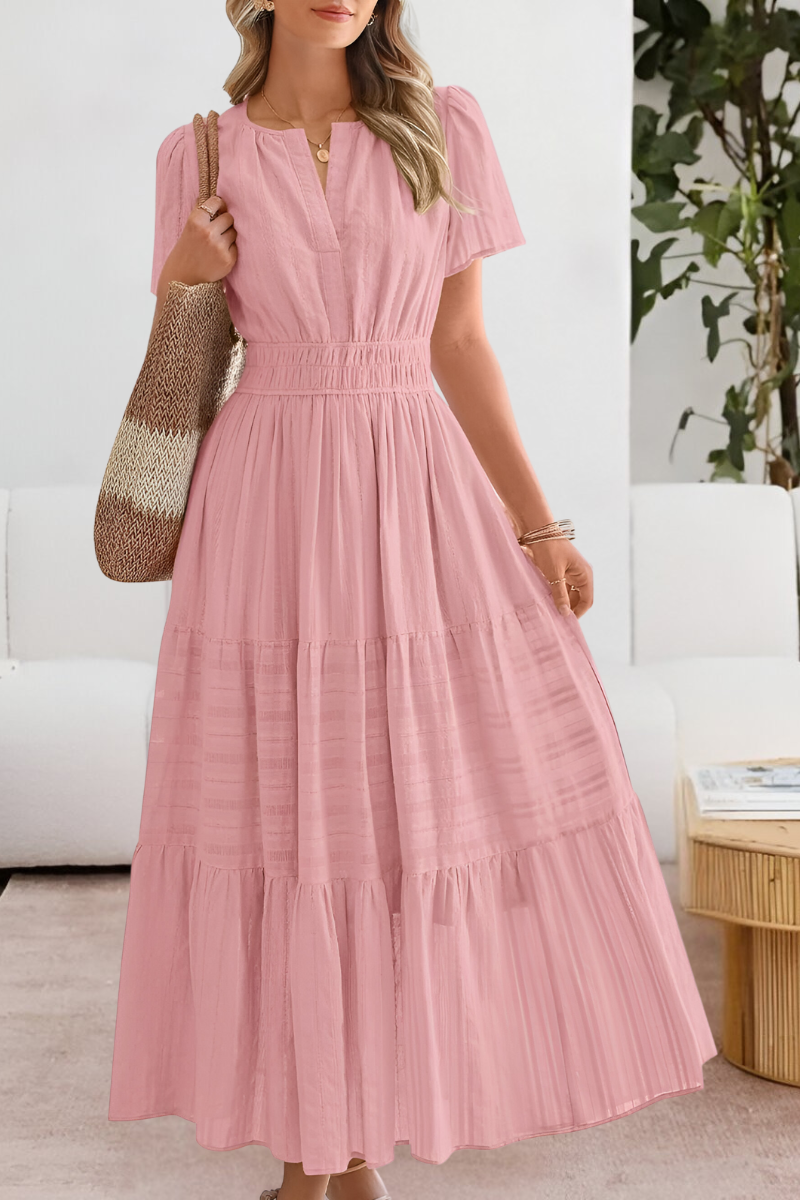 Back view showing the graceful drape and tiered construction of the midi dress