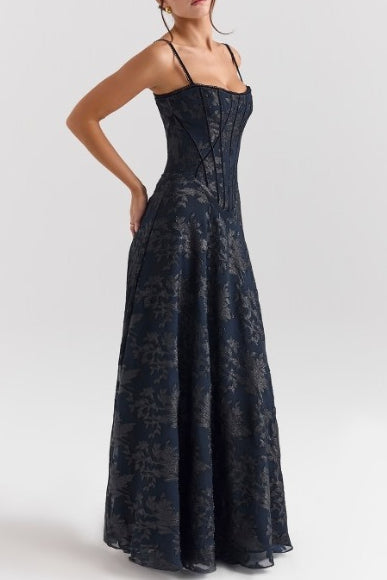 Close-up of floral mesh overlay and patchwork detailing on chiffon formal maxi dress