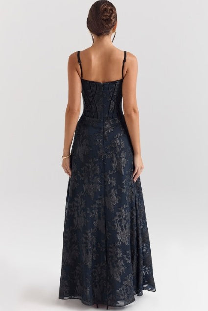 Back view of spaghetti strap chiffon floral formal dress with flowing skirt and structured bodice