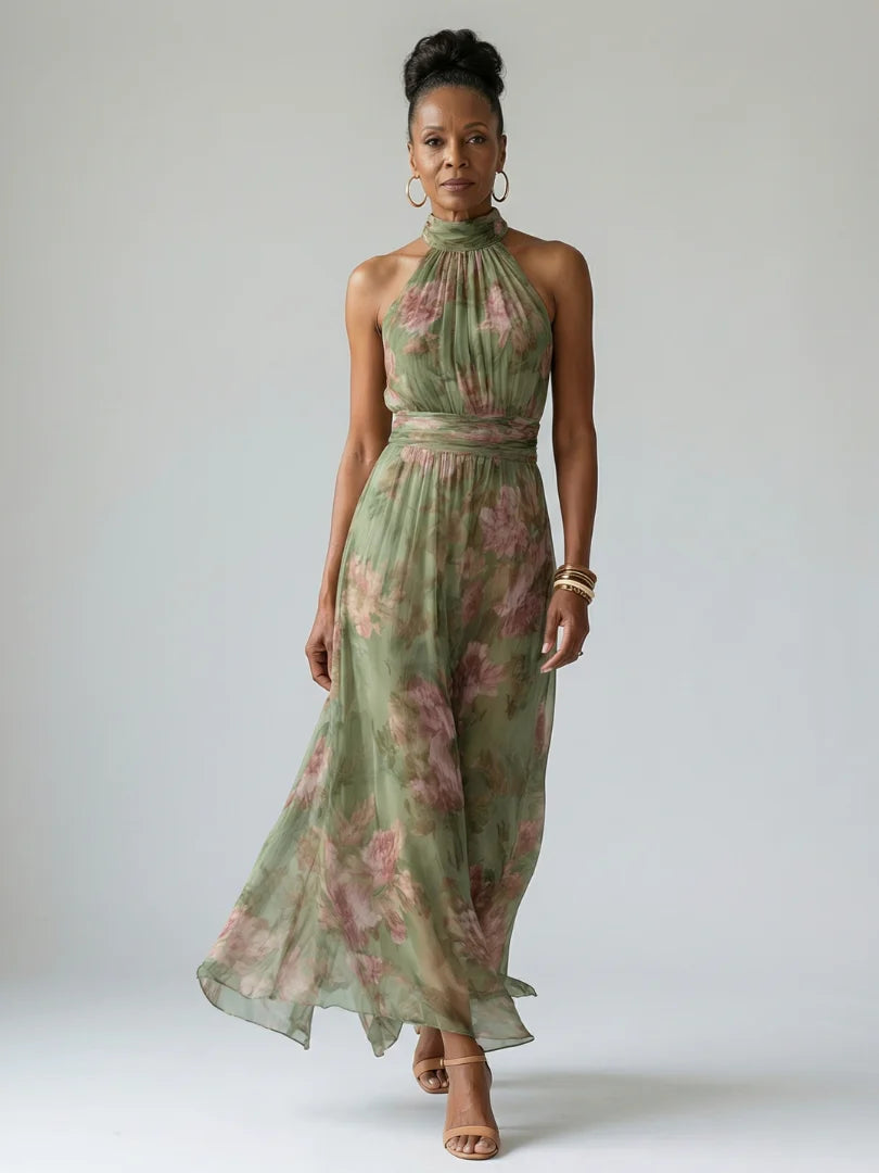 Model wearing sage green Gathered Halter Midi Dress with floral pattern and halterneck design