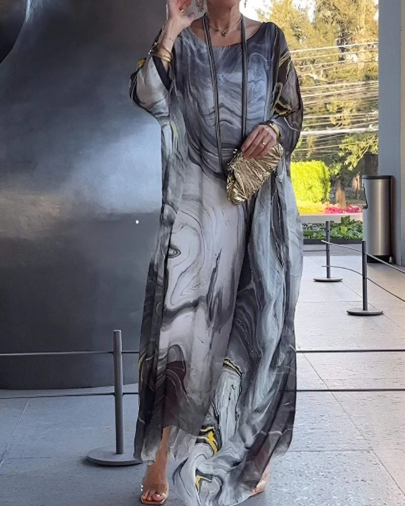 Close-up view of abstract marble print pattern on ankle-length maxi dress