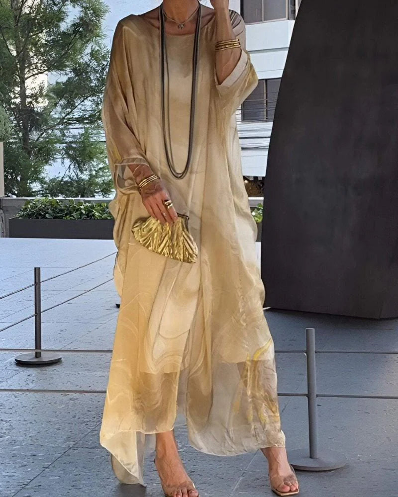 Full-length view of flowing marble print maxi dress with round neckline