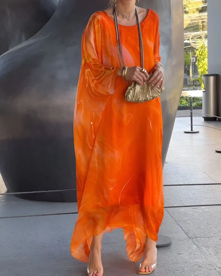 Woman styling marble print maxi dress with flat sandals for casual wear