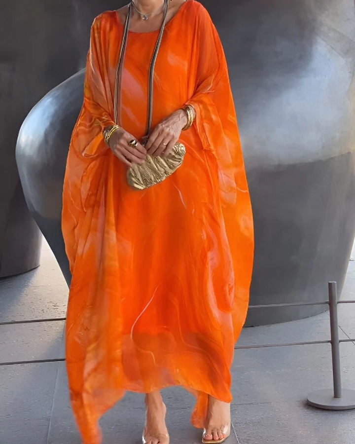 Rear view of ankle-length marble print maxi dress showing loose silhouette