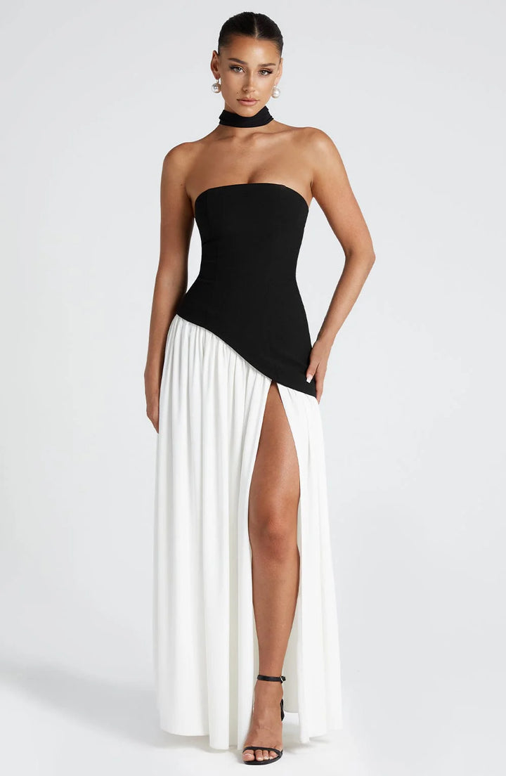 Grace wearing a Strapless Maxi Dress with High Slit featuring an asymmetric waist and flowing full-length skirt