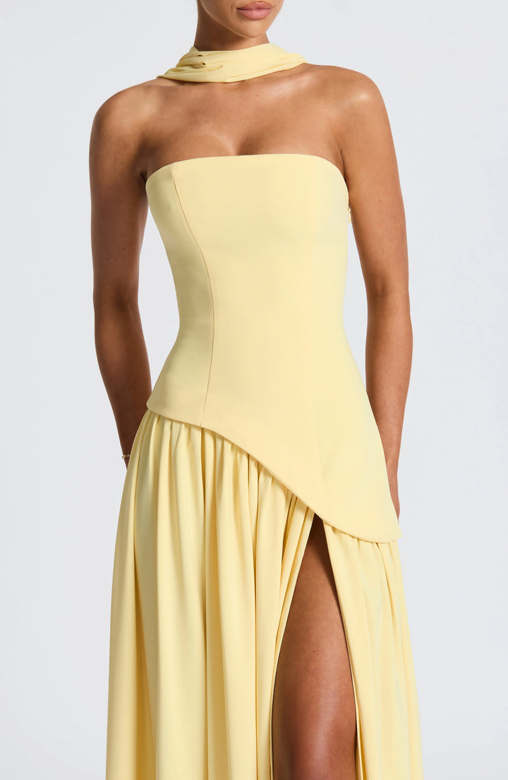 Front view highlighting the asymmetric waist detail and maxi-length silhouette