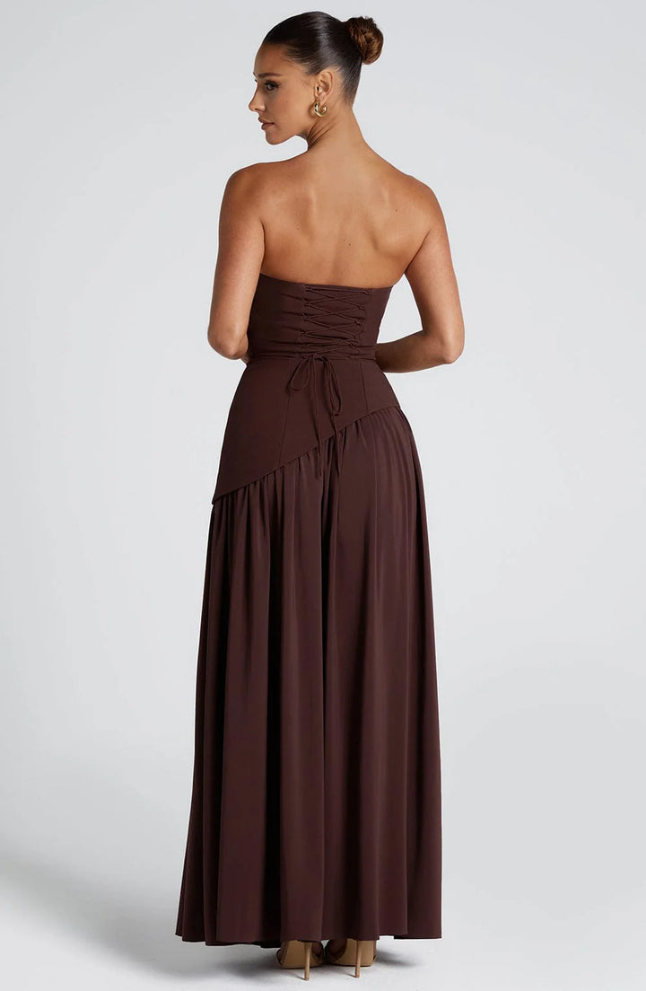Side profile showing the structured bodice and flowing maxi skirt drape