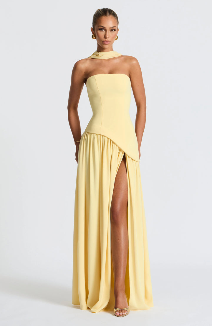 Model wearing the Strapless Maxi Dress with High Slit paired with heeled sandals