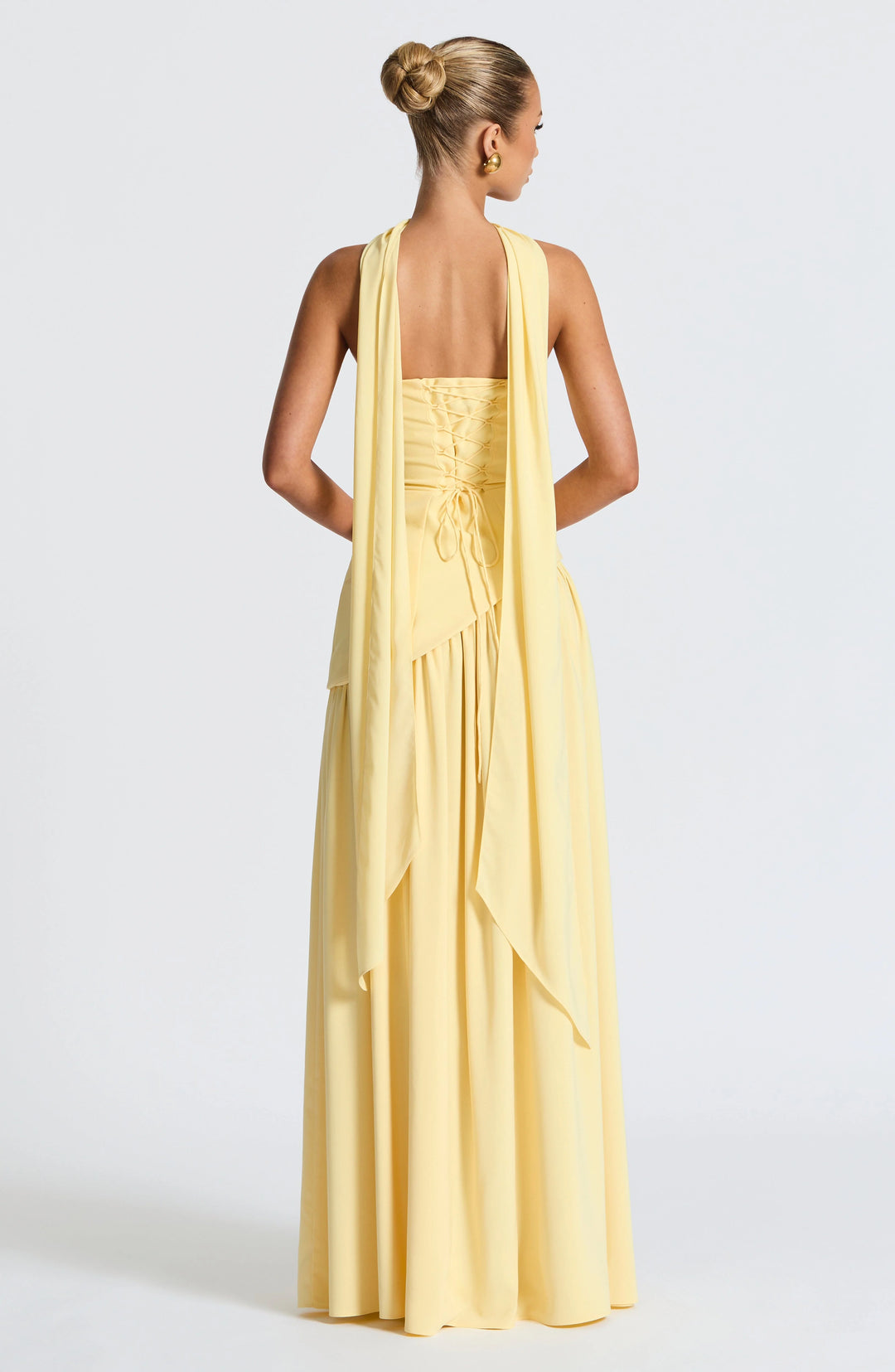Movement shot showing the high slit and drape of the full-length skirt