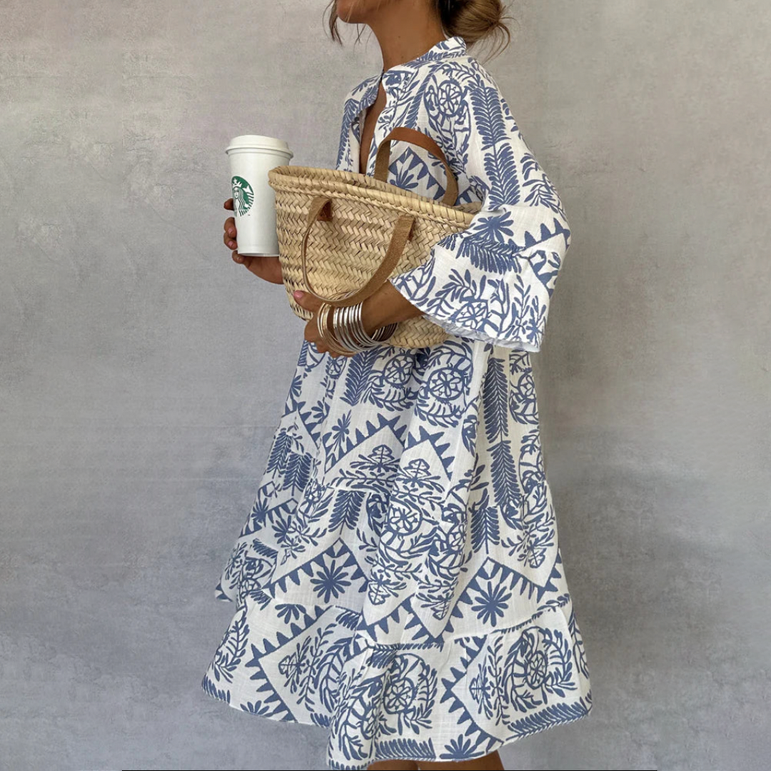 Grace wearing Women's Boho Patterned Long Sleeve Mini Dress with bold geometric print and relaxed silhouette