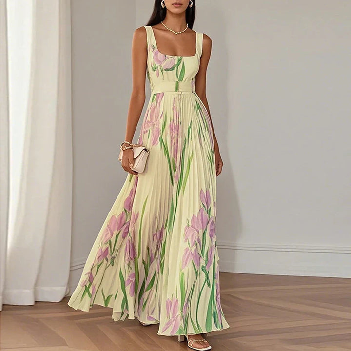 Full-length view showing A-line silhouette and pleated skirt with botanical design