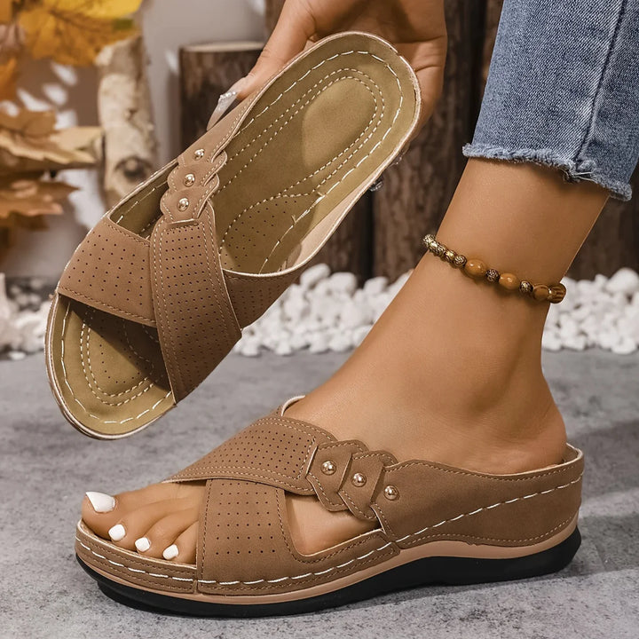 Top-down view of orthopaedic sandals displaying cross-strap layout and open-toe silhouette