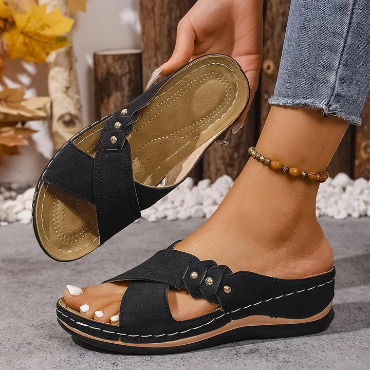 Women's cross-strap sandals with perforated detailing and contoured footbed for all-day comfort