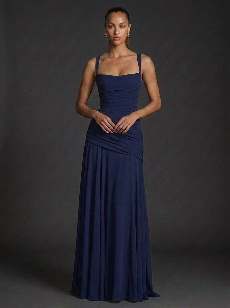 Close-up detail of ruched waist draping on fitted maxi dress bodice