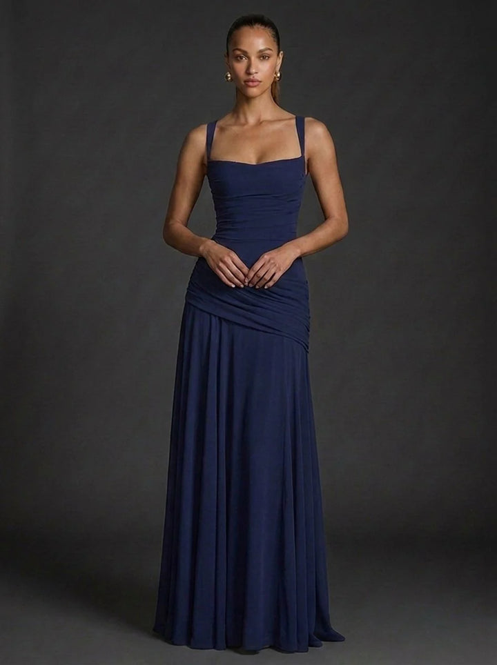 Close-up detail of ruched waist draping on fitted maxi dress bodice