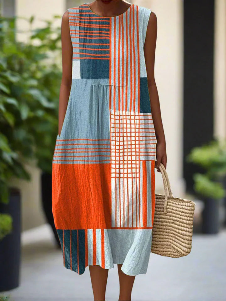 Women's Midi Dress with Geometric Design and Relaxed Fit featuring colour-blocked stripes and checks in orange, blue, and white tones with practical side pockets