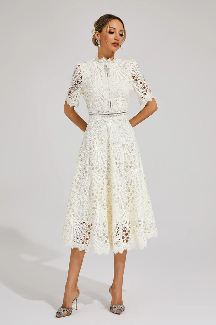 Close-up of structured crochet fabric and geometric pattern on occasion dress