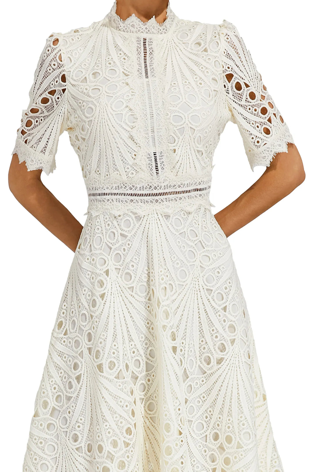 Crochet midi dress styled for garden party with heeled sandals and statement earrings