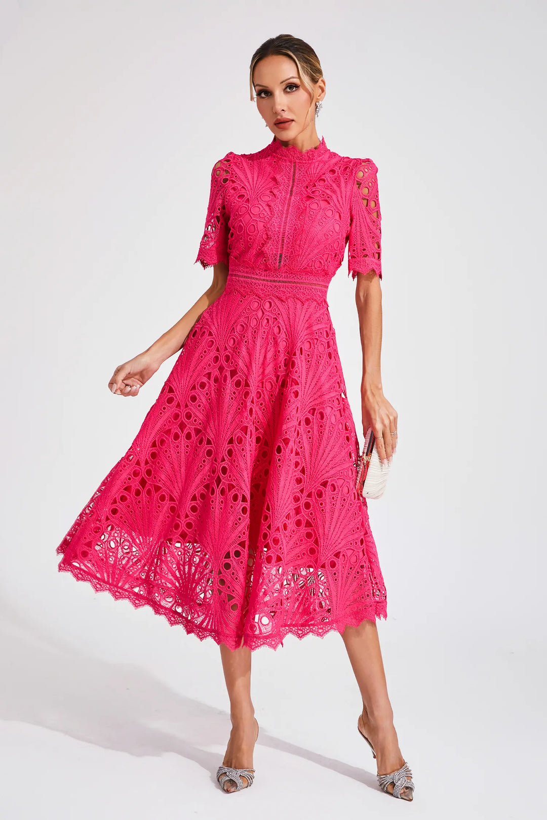 Close-up of geometric crochet pattern and structured openwork fabric on midi dress