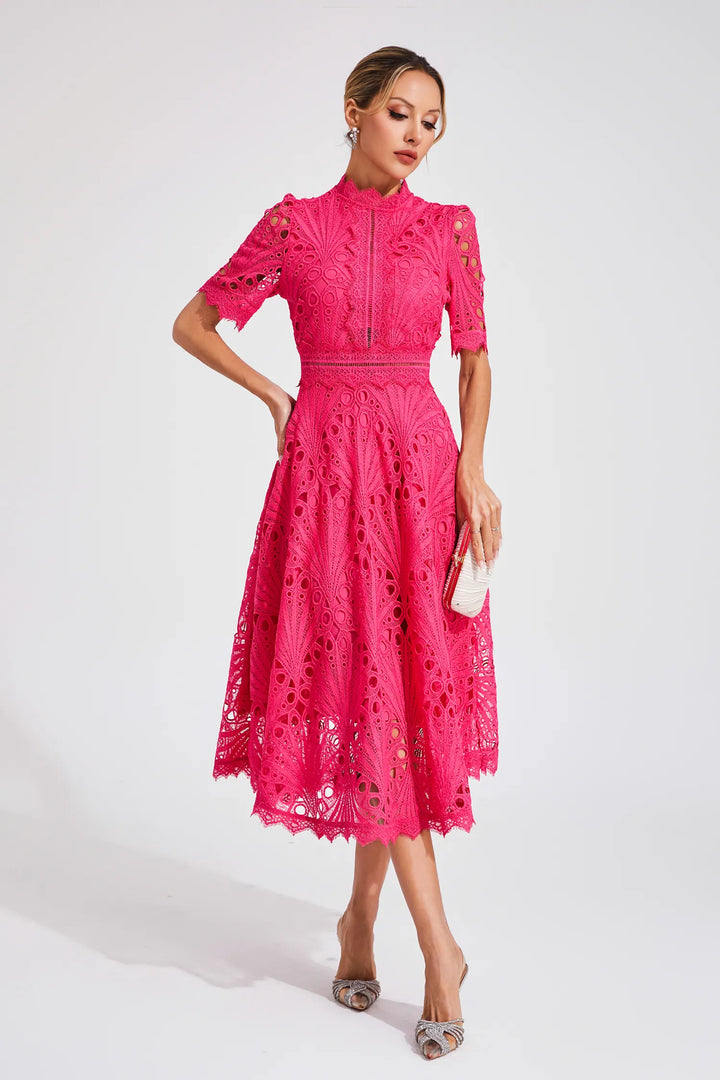 Back view of high neck crochet midi dress with defined waist and midi length