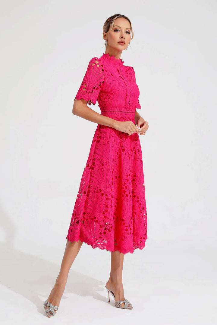 Close-up of openwork crochet detailing and structured fabric on midi dress bodice