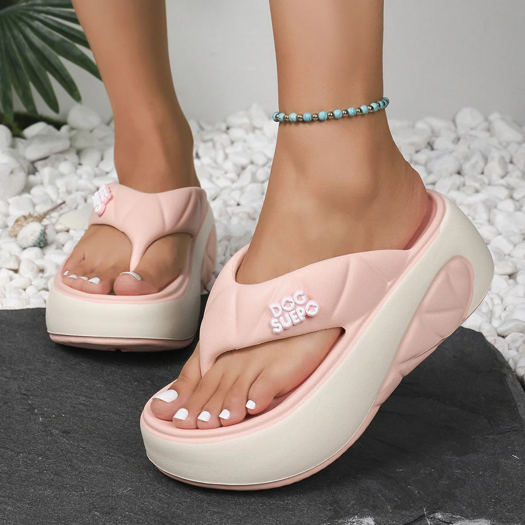 Women's Comfort Orthopaedic Summer Sandals in pink with thong-toe strap and cushioned platform sole worn outdoors