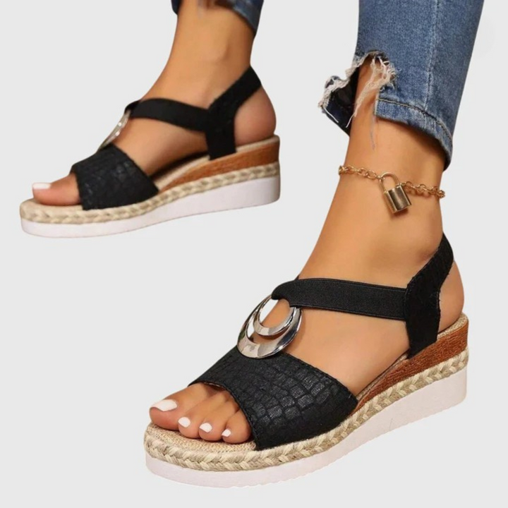 Women's orthopedic buckle strap sandals on model showing natural walking position and ankle support