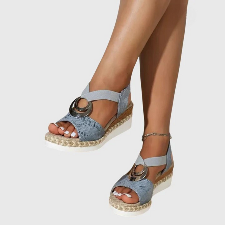 Detail shot of adjustable metal buckle and ankle strap on women's orthopedic sandals