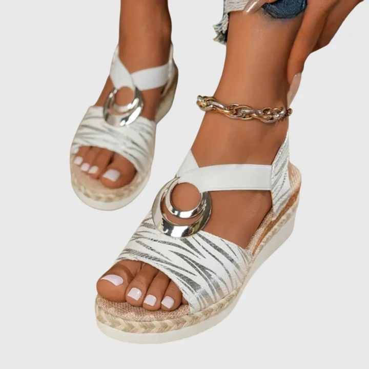 Rear view of women's orthopedic buckle strap sandals showing heel counter and espadrille wrapping