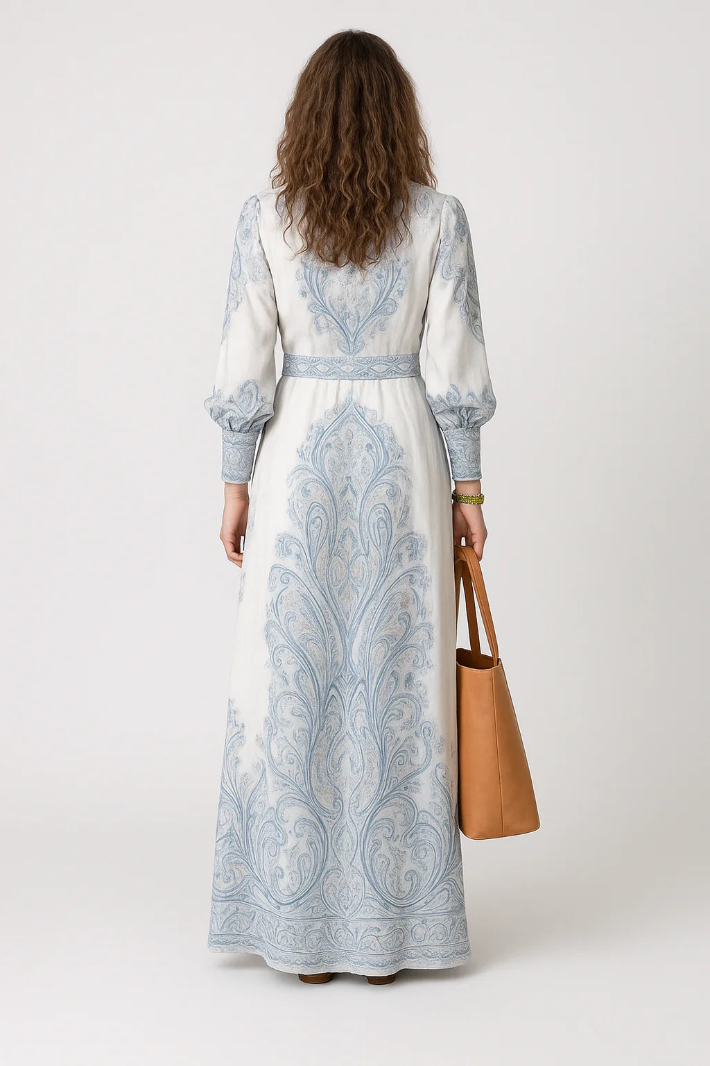 Long sleeve dress with gathered cuffs and full-length skirt showcasing intricate blue and white paisley pattern