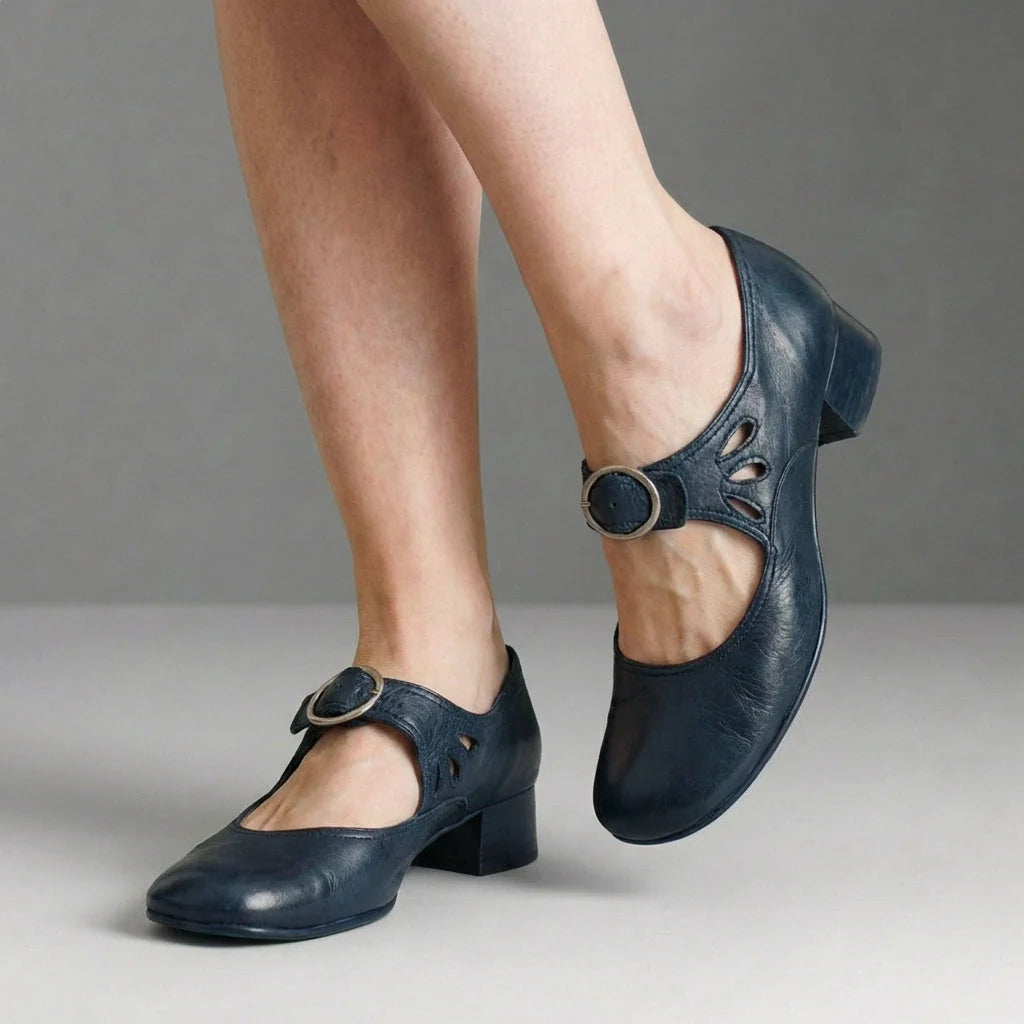 Side profile of low block heel Mary Jane shoe showing structured silhouette