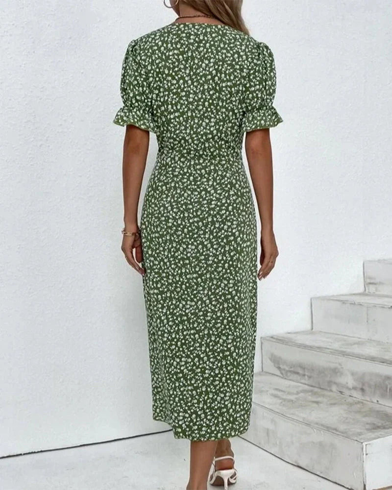 Green floral wrap midi dress featuring ruffled short sleeves and V-neck detail for versatile daywear