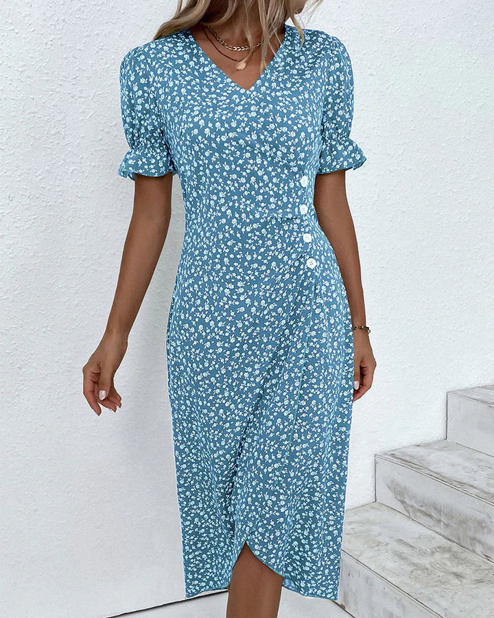 V-neck floral wrap dress in green showcasing adjustable waist tie and midi-length hem