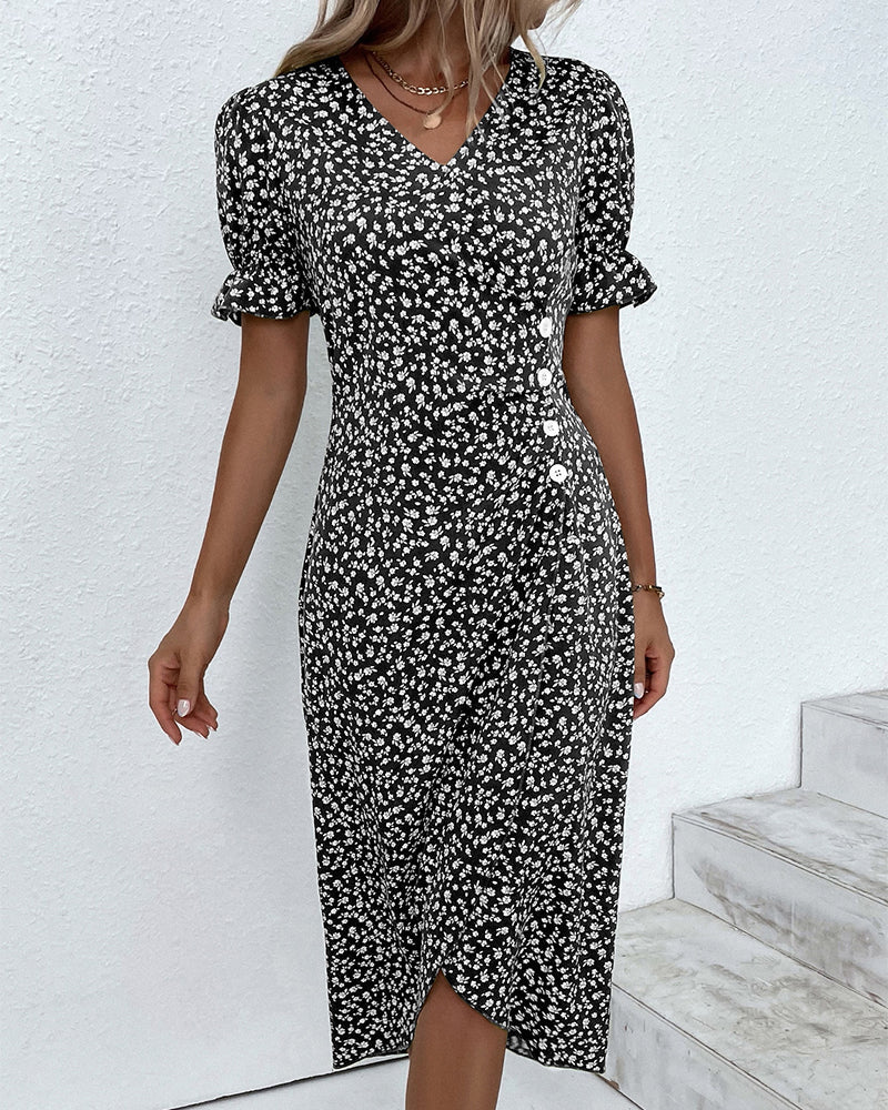 Green wrap dress featuring cream floral pattern, V-neckline and tailored silhouette for daywear