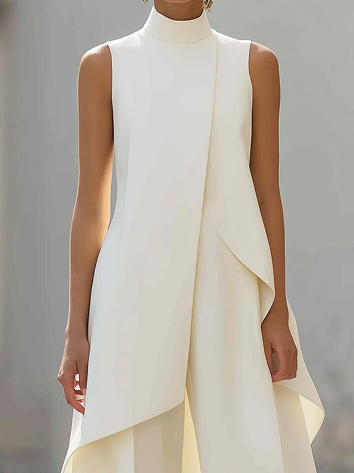 Front view of sleeveless high-neck top with asymmetric layered panel and matching wide-leg trousers